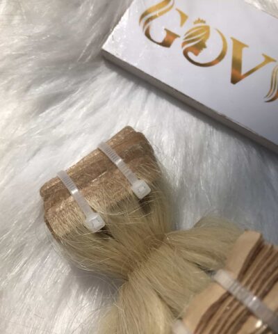 Invisible tape hair extensions blonde color