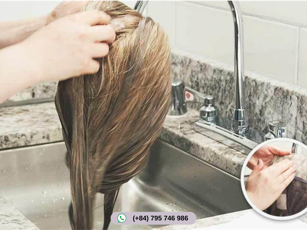 Wash and massage hair to remove dirt