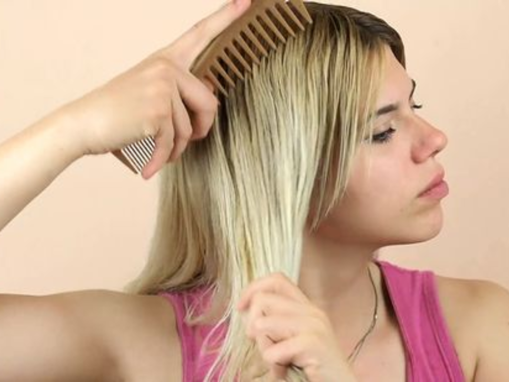 You can shape your bangs by using a wide-tooth comb and a blow dryer