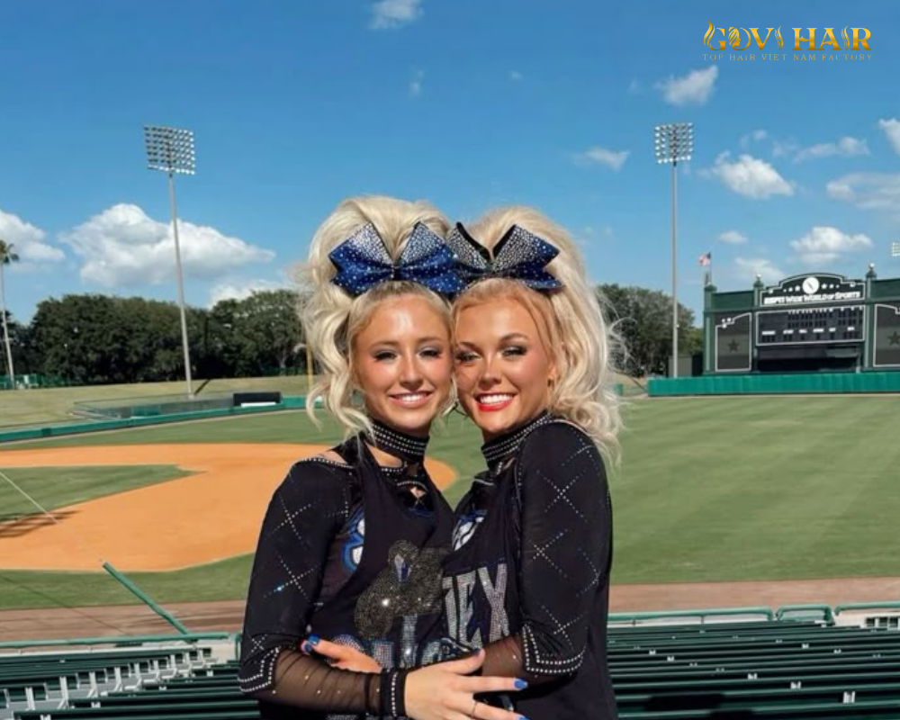 High, bouncy cheerleader ponytail with volume and energy.