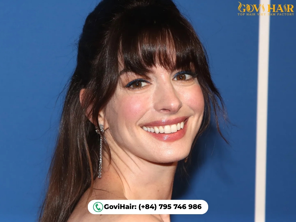 Bangs vs No Bangs: Which One Is Right For You? 1 Bangs framing face and creating youthful softness