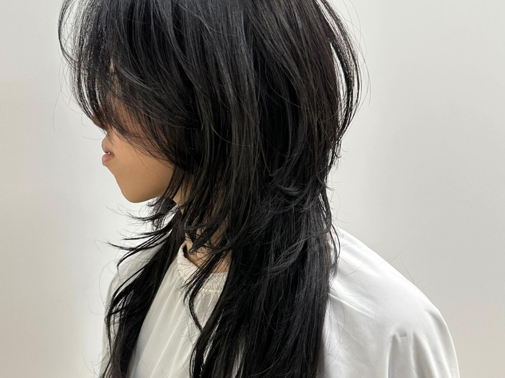 Deeply layered wolf cut with crown volume