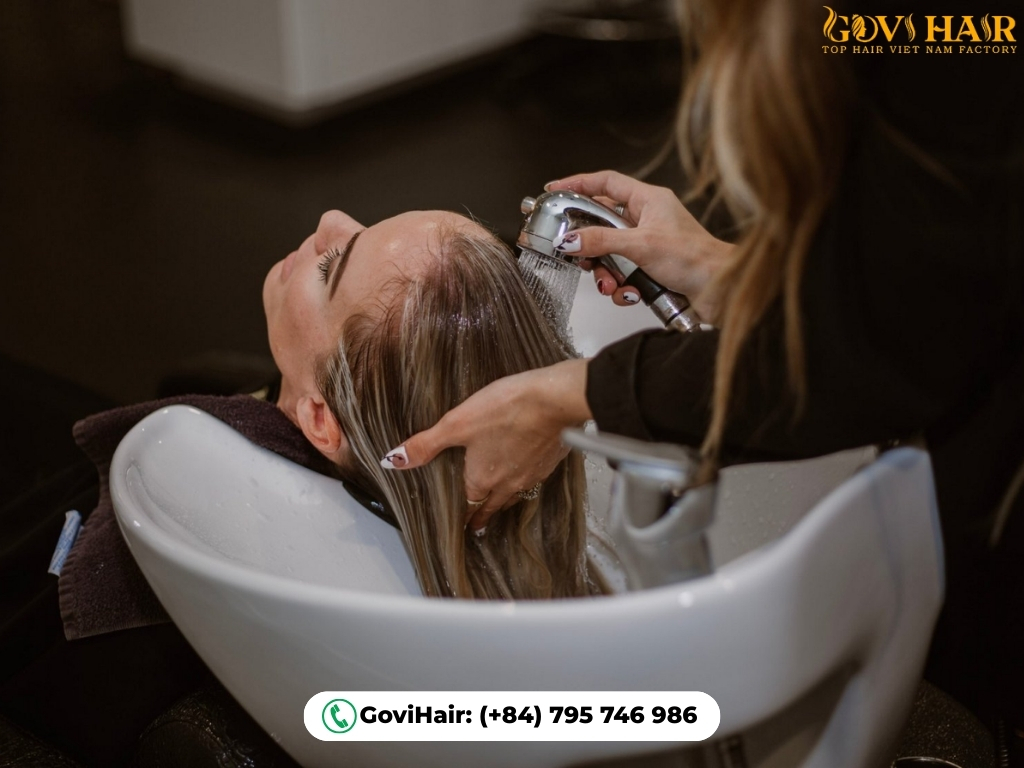 Hair toner applied by colorist at salon