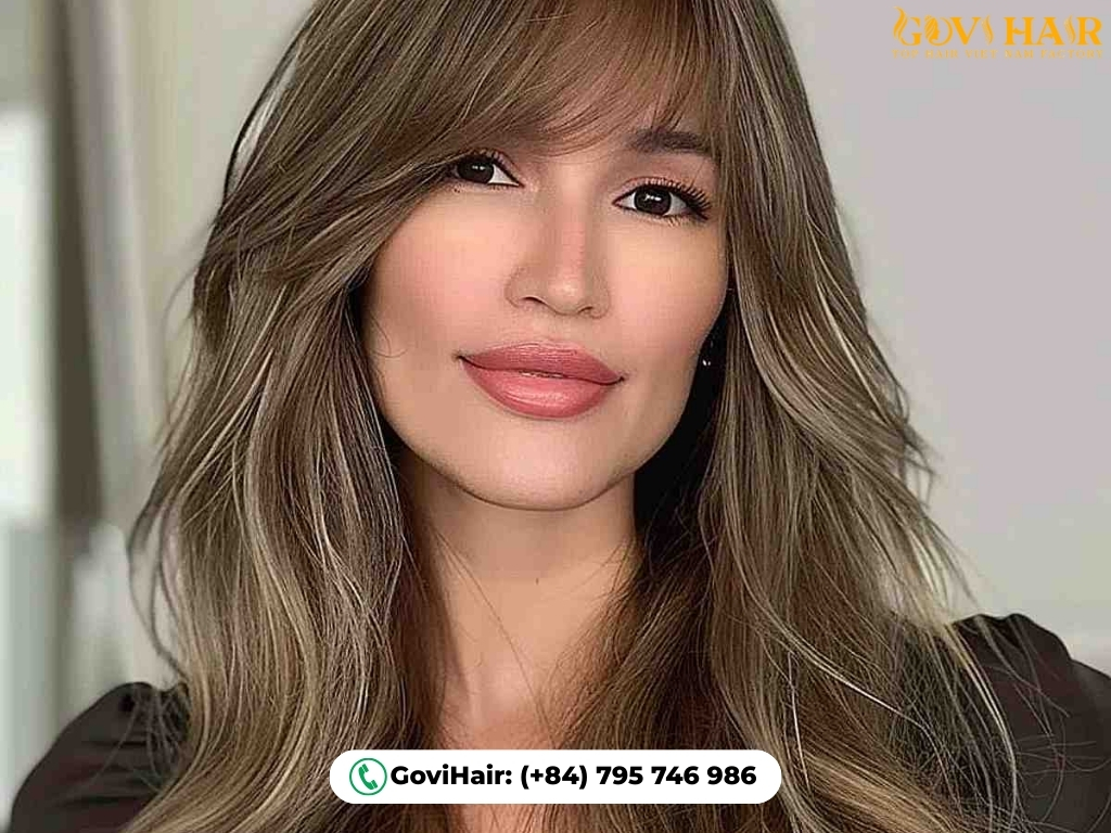 Ombre layered wolf cut with long, side-swept bangs