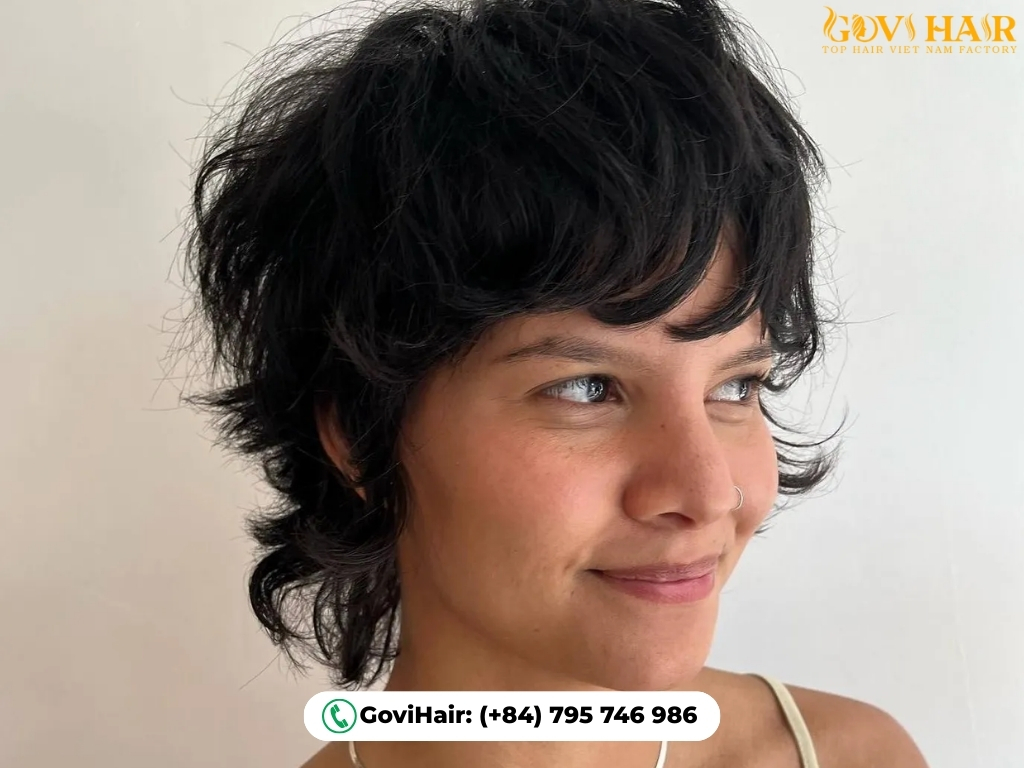 Pixie-length wolf cut with layered, textured fringe