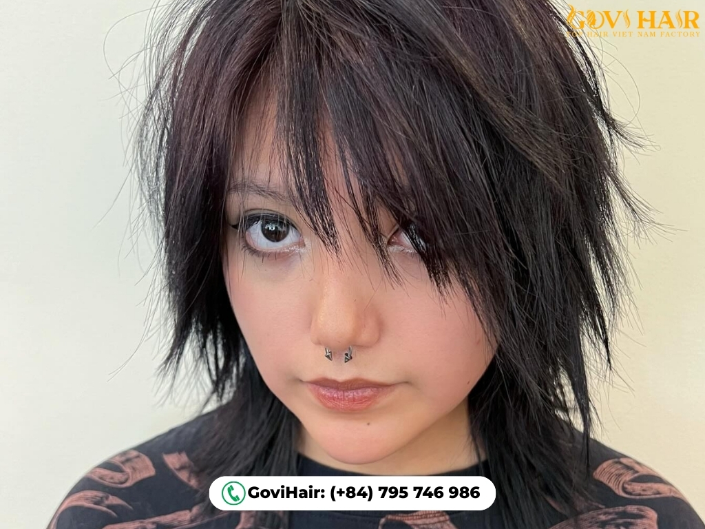 Razor-cut wolf cut with wispy, textured ends