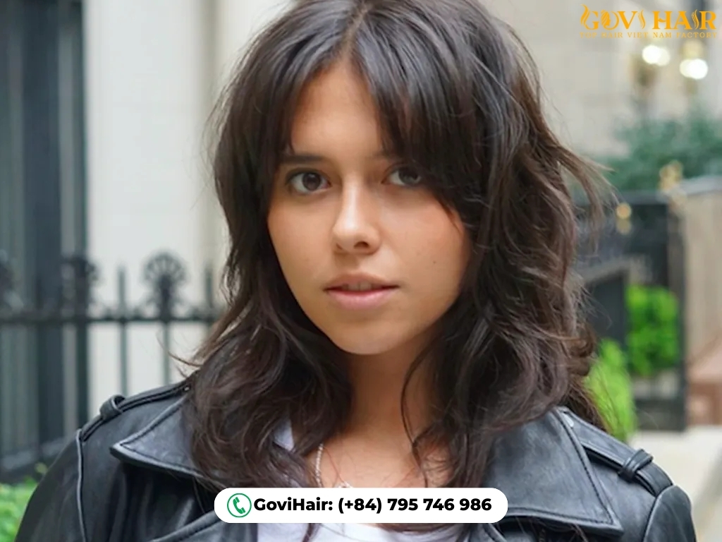 Shaggy wolf cut with layers and face-framing curtain bangs