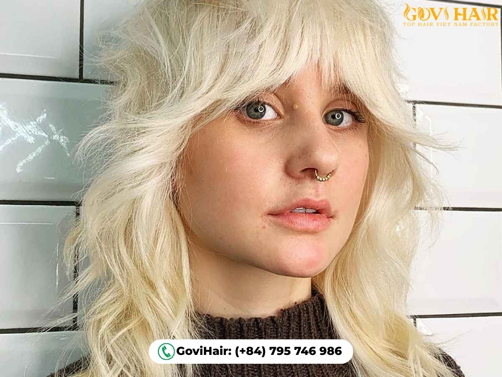 Shoulder-length wolf cut with cute, baby-short bangs