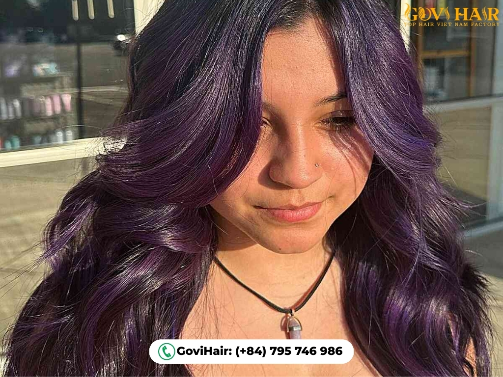 Violet face-framing highlights on dark hair