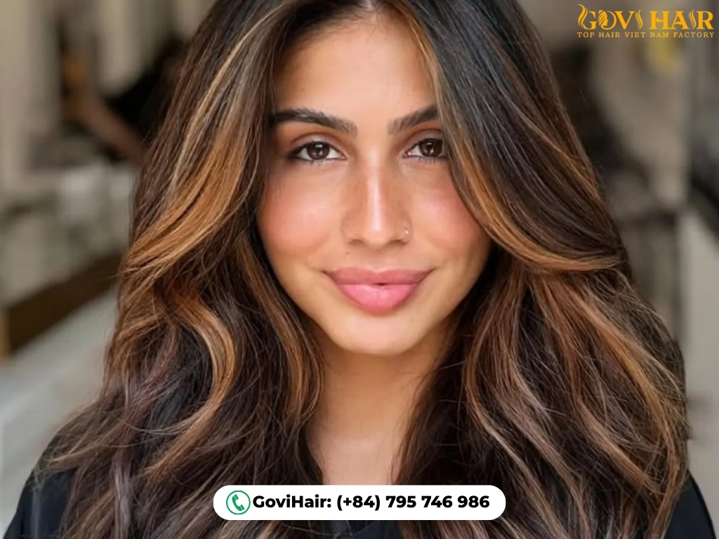 Warm caramel highlights on brown hair