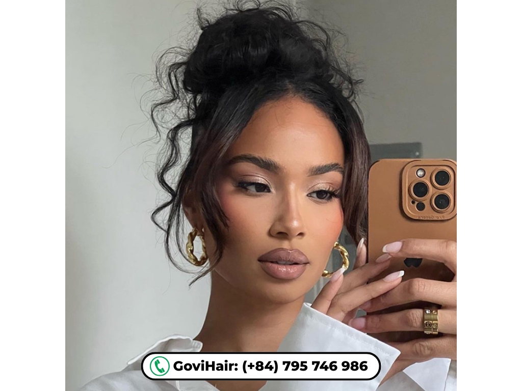 Messy bun with face-framing pieces hairstyle