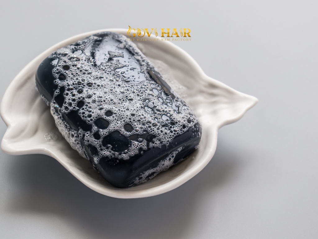 Dish soap is effective at stripping oils and color from hair