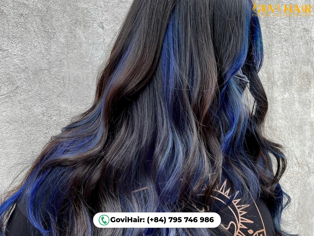 Black hair subtly enhanced with dark blue highlights for depth