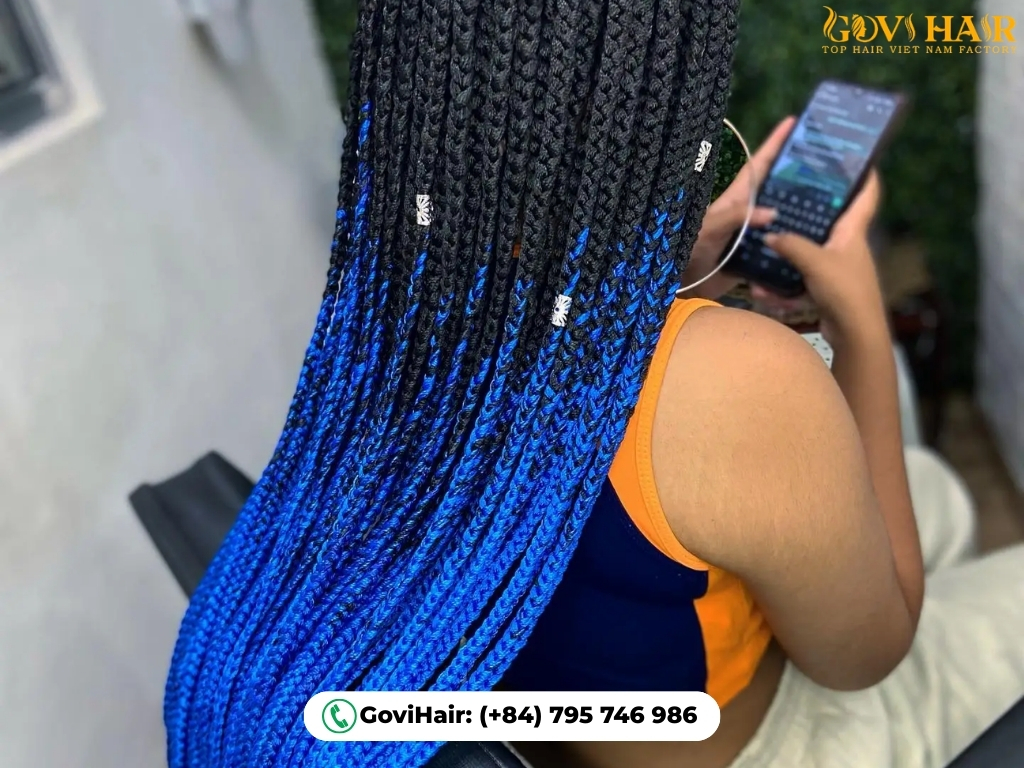 Blue Braided Hairstyle uses navy braids for bold, protective style