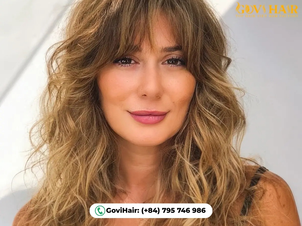 Romantic long waves with signature Bardot fringe