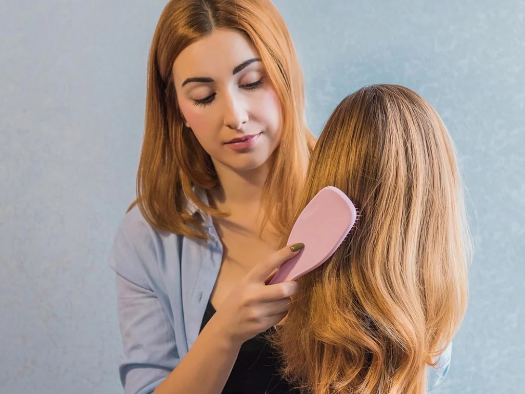 Use a wide-tooth comb to gently remove knots, starting from the ends and working your way up.