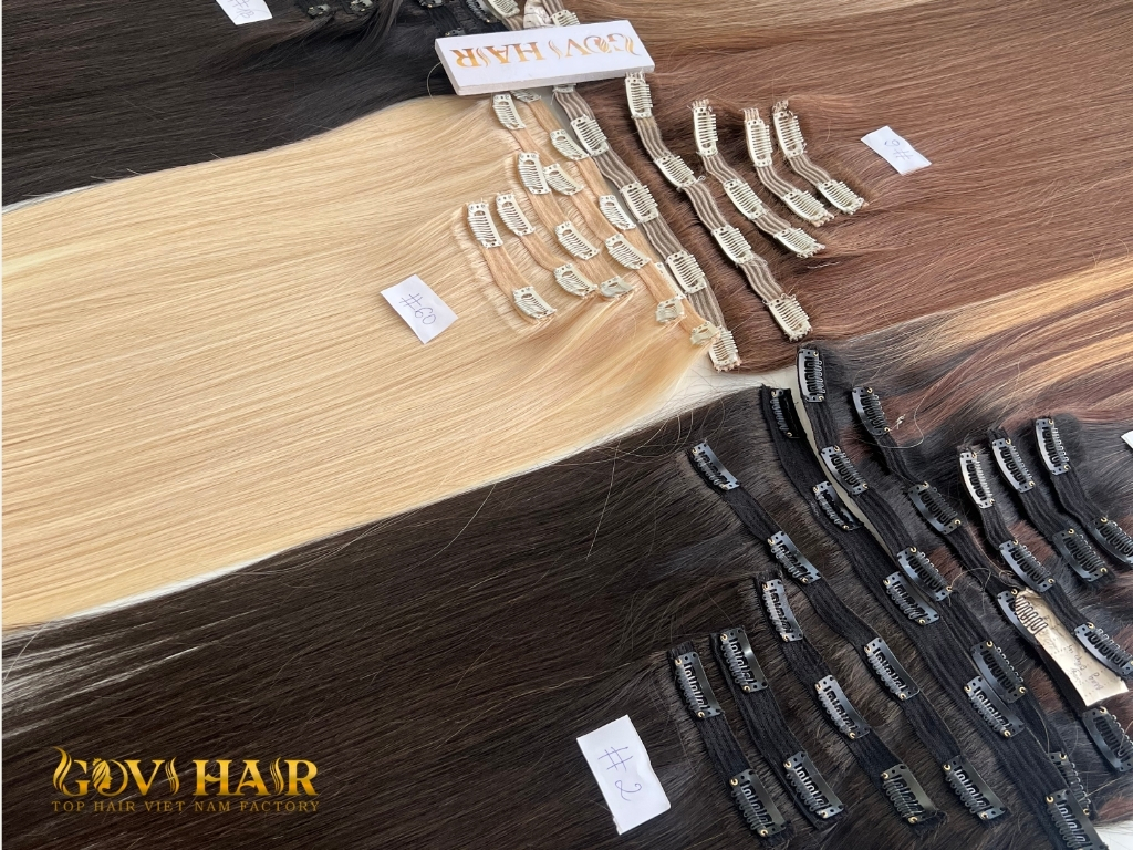 Can You Sleep With Clip In Hair Extensions? The Honest Truth 2 Clip in hair extensions with metal clips attached to hair wefts