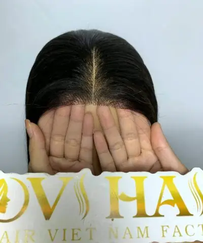 28 inch wig closure held by hand
