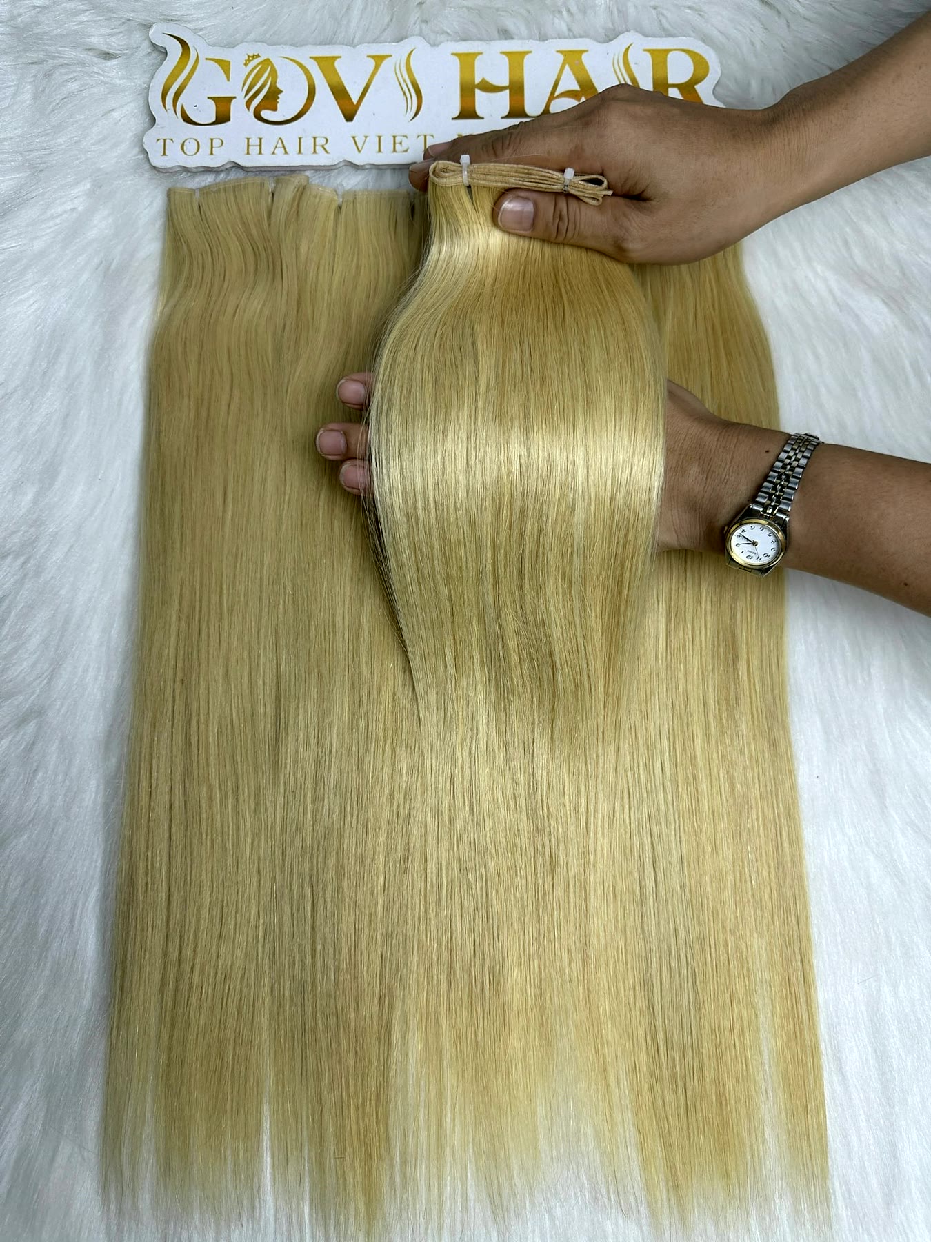 Genius Hair Wefts 16 Inch #613 Blonde Bone Straight Raw Vietnamese Hair 1 Genius hair wefts #613 blonde held by hand