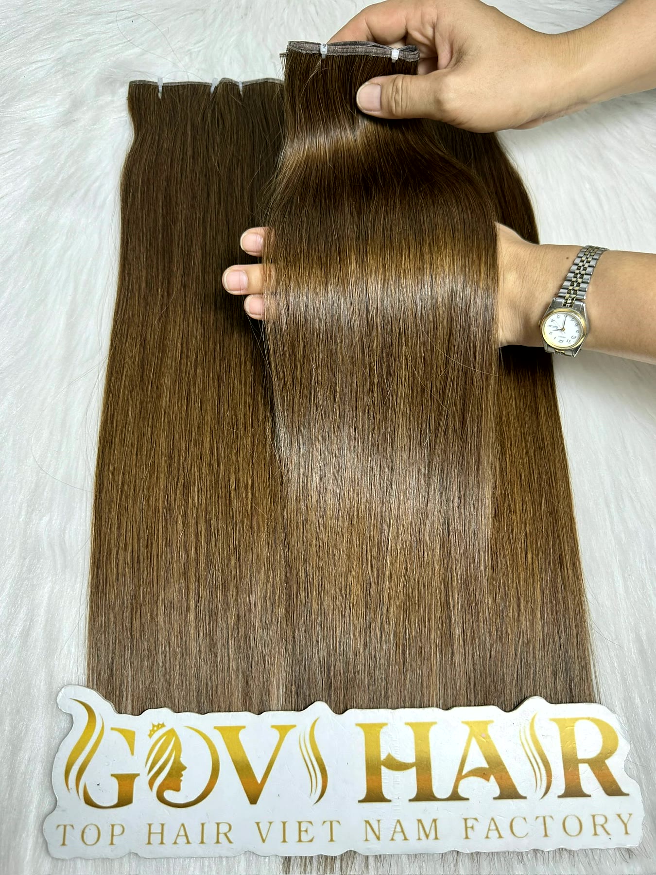 Genius Weft Extensions 18 Inch Bone Straight Dark Brown Human Hair 1 Genius weft extensions dark brown held by hand