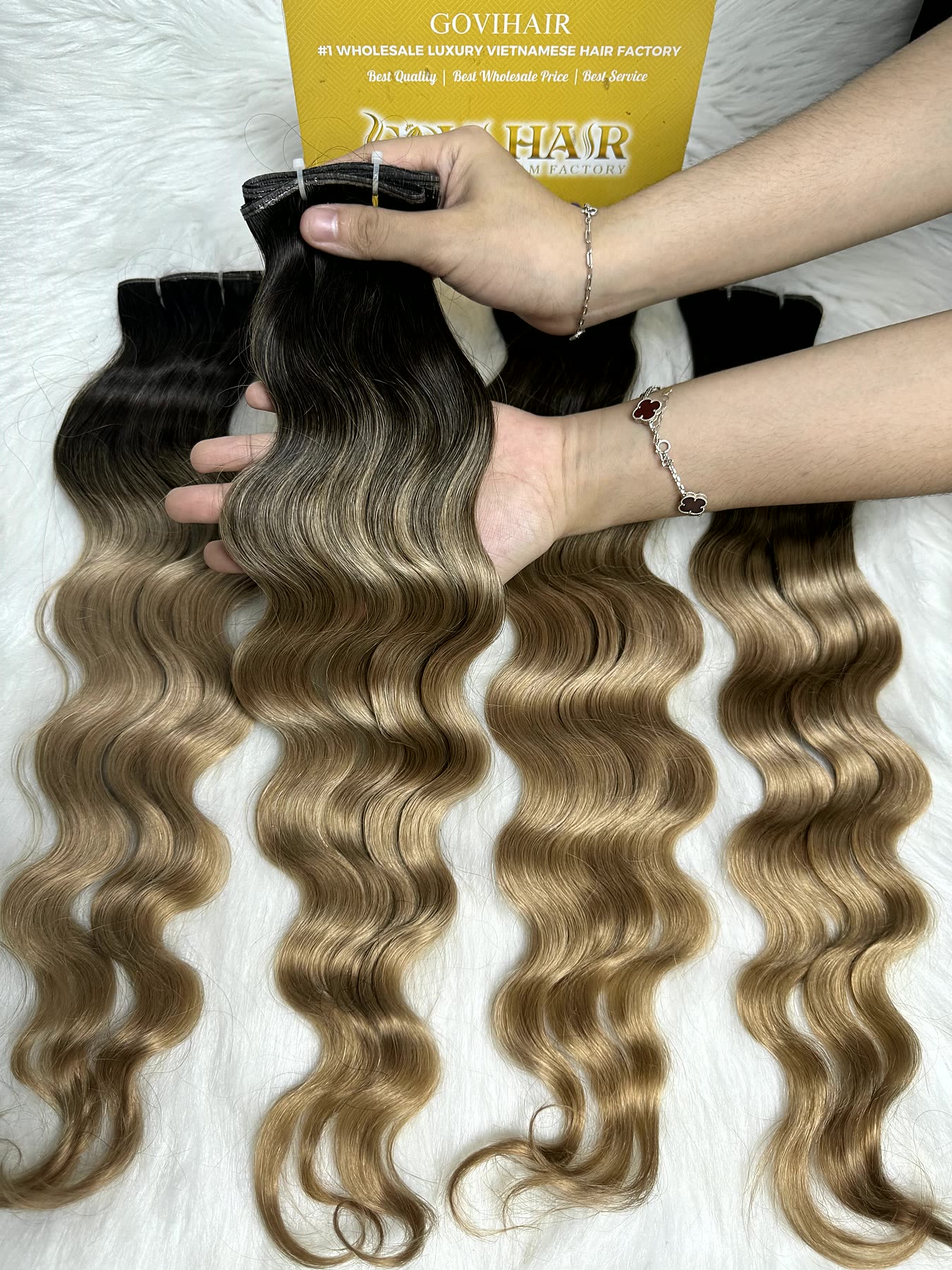 Wavy Genius Weft Extensions 20 Inch Ombre Blonde Natural Wave Raw Hair 1 Wavy genius weft extensions ombre blonde held by hand