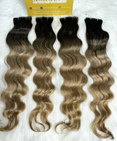 Wavy genius weft extensions 20 inch ombre blonde