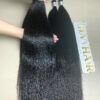 raw Vietnamese bulk hair held by hand showing shine