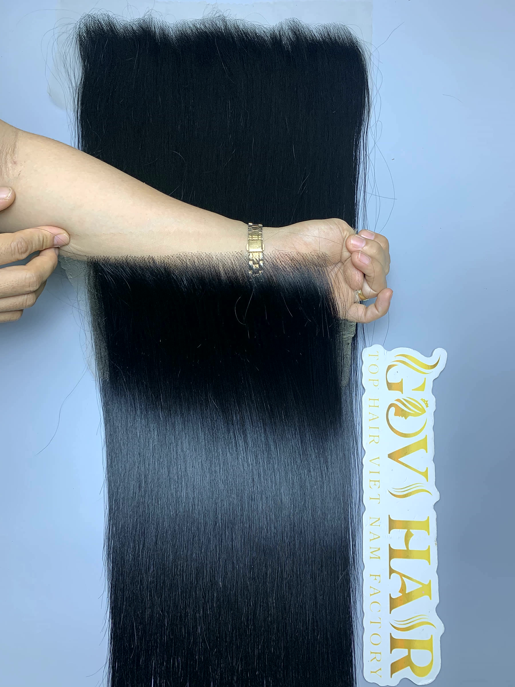 20 Inch Raw Hair Lace Frontal 13x4 Bone Straight HD Lace Wholesale 1 raw hair lace frontal 13x4 held by hand showing shine