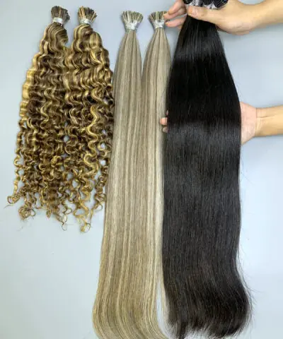 I tip hair extensions held by hand showing shine