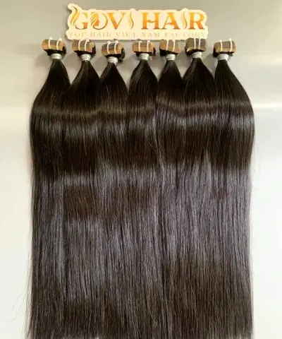 raw tape in hair extensions close up view 2