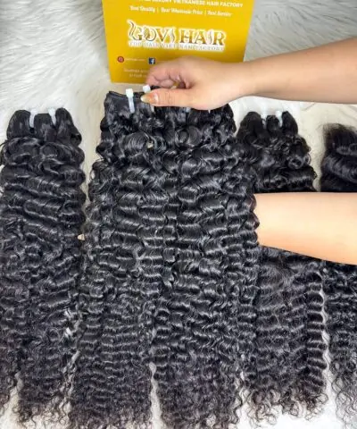 Raw Burmese curly hair 24 inch held by hand