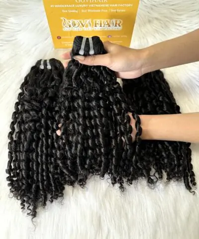 Pixie curly hair bundles held in hand