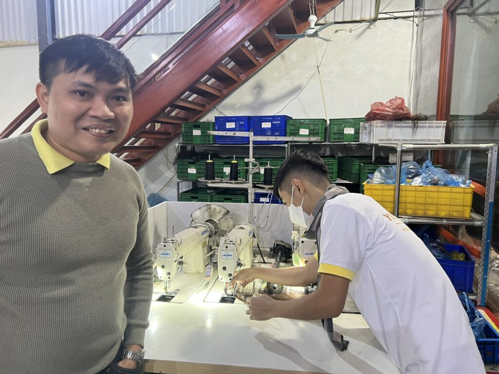 Tommy Huynh at the Govihair factory sewing line in Da Nang