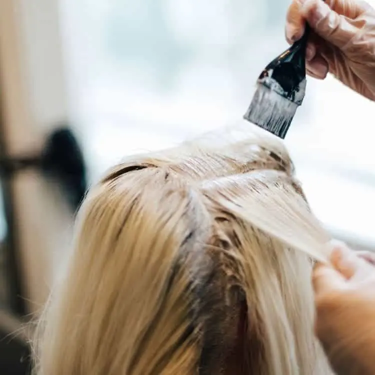 Wear protective gloves to protect hands Protect hair