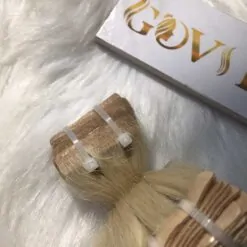 Invisible tape hair extensions blonde color