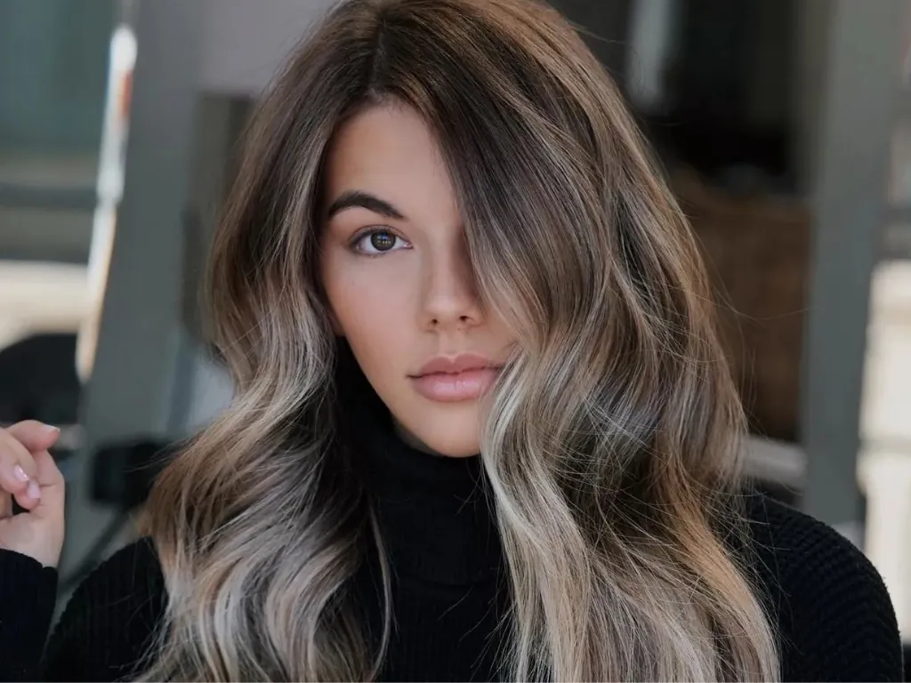 Ash blonde highlights add cool subtle dimension
