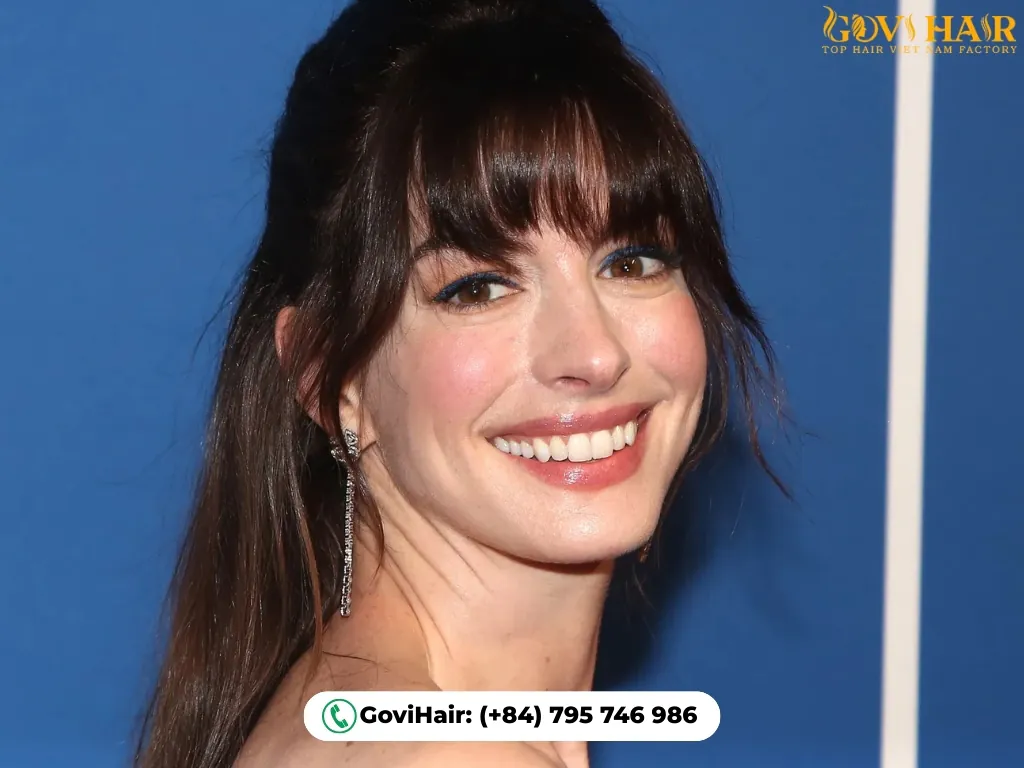 Bangs framing face and creating youthful softness