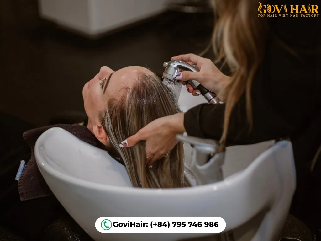 Hair toner applied by colorist at salon