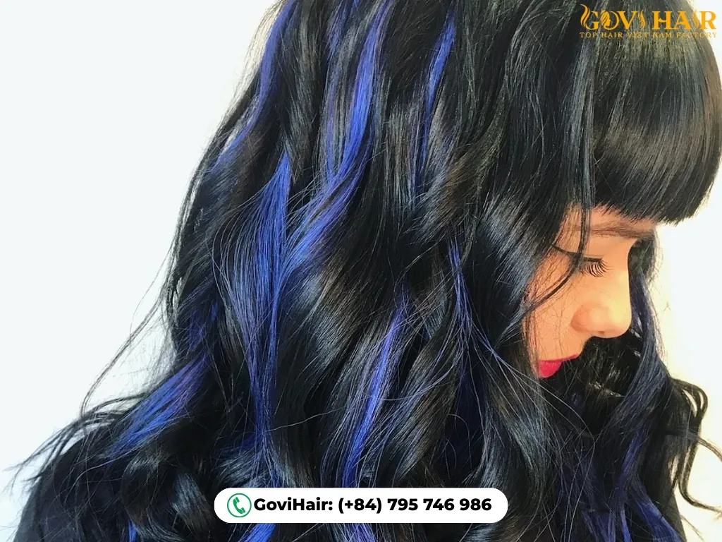 Midnight blue streaks in black hair