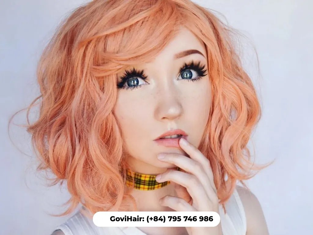 Soft curly peach blonde bob