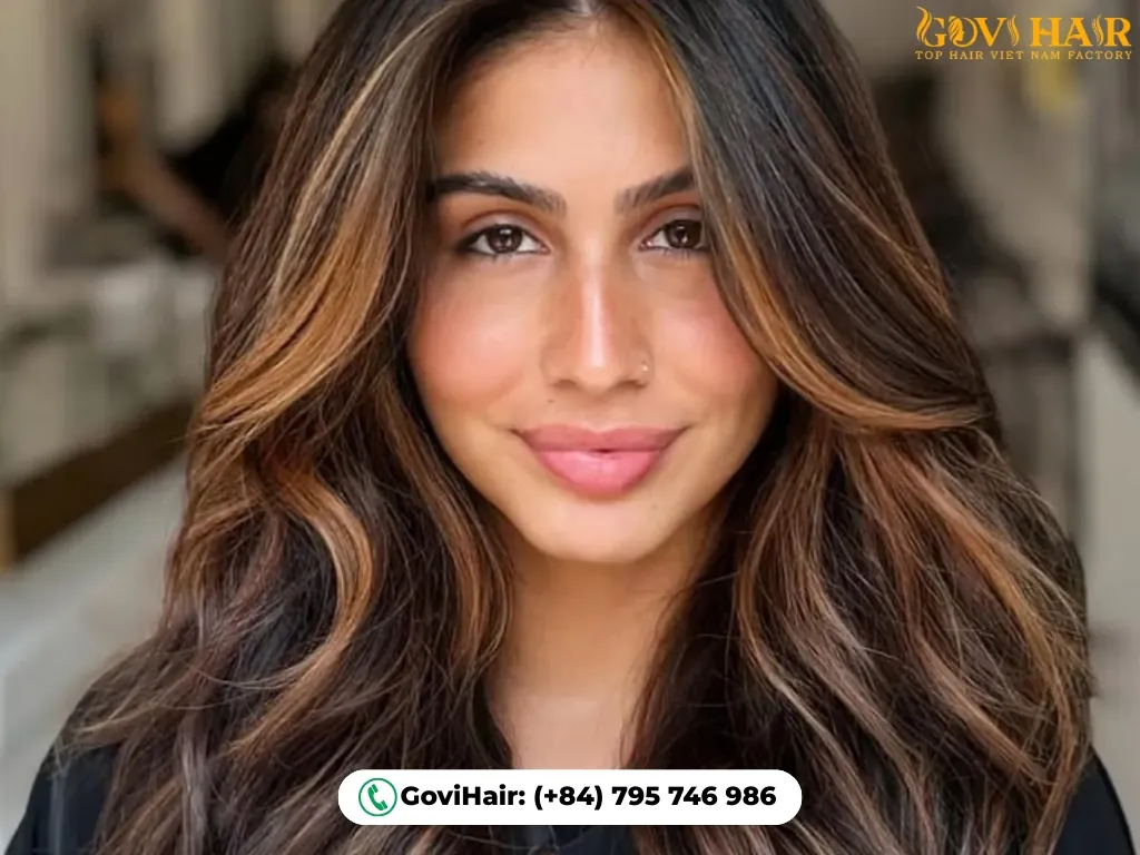 Warm caramel highlights on brown hair