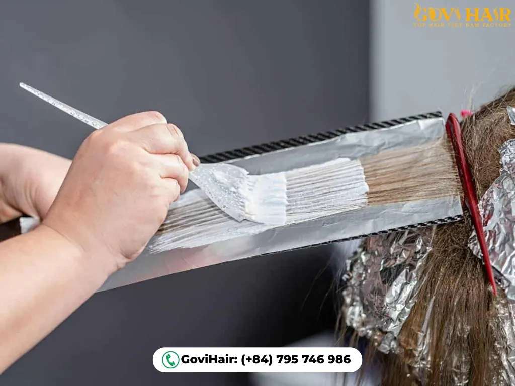 Foil-induced heat accelerating bleach processing