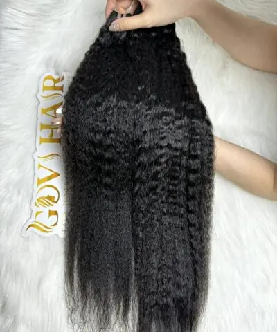 Kinky straight bundles 24 inch held by hand