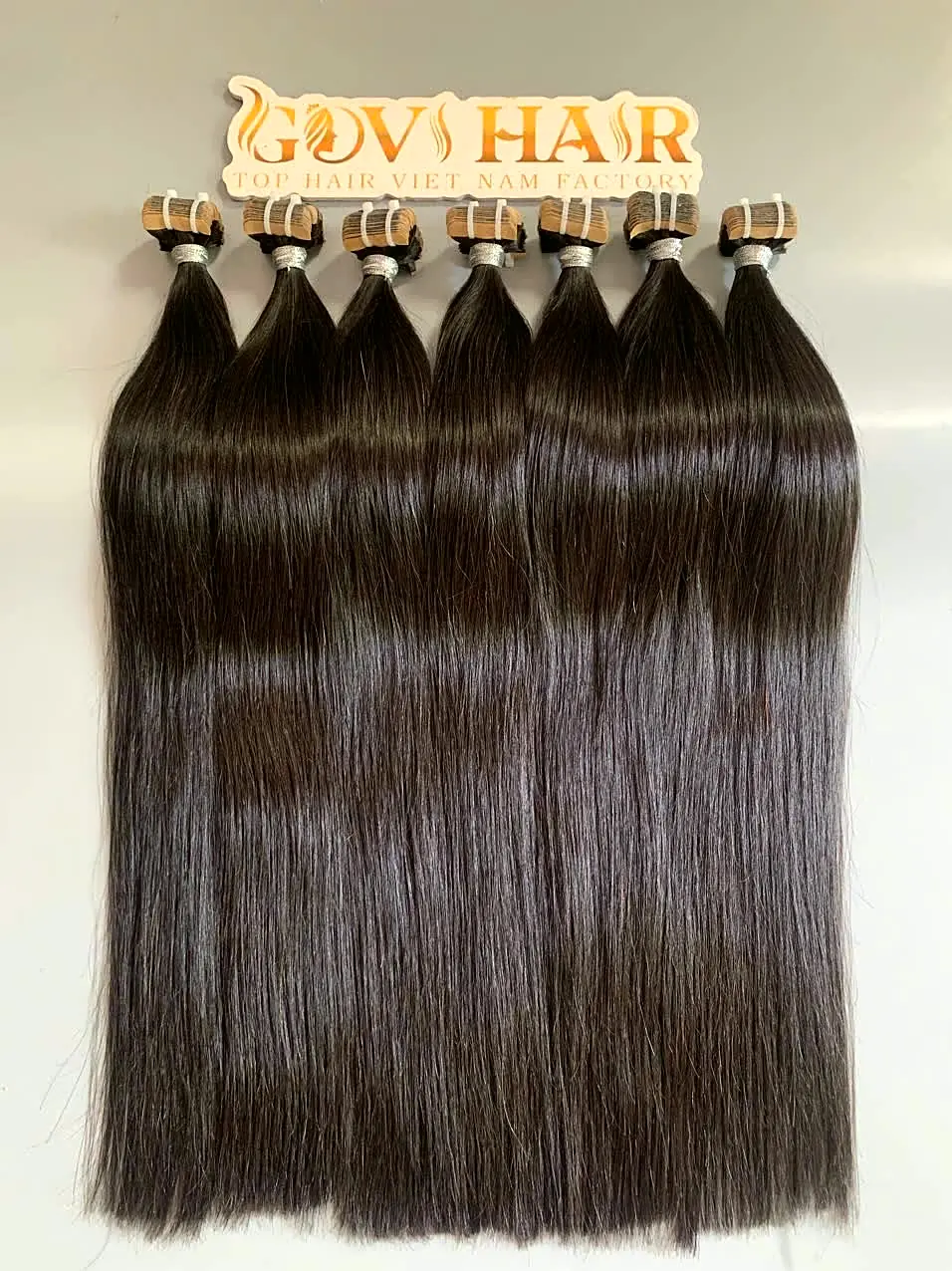 raw tape in hair extensions close up view 2