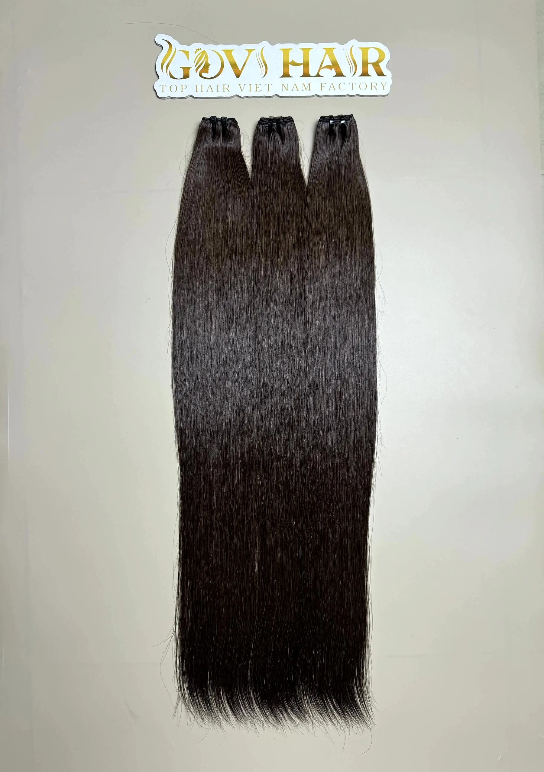 raw hair bundles in natural brown close up view 2
