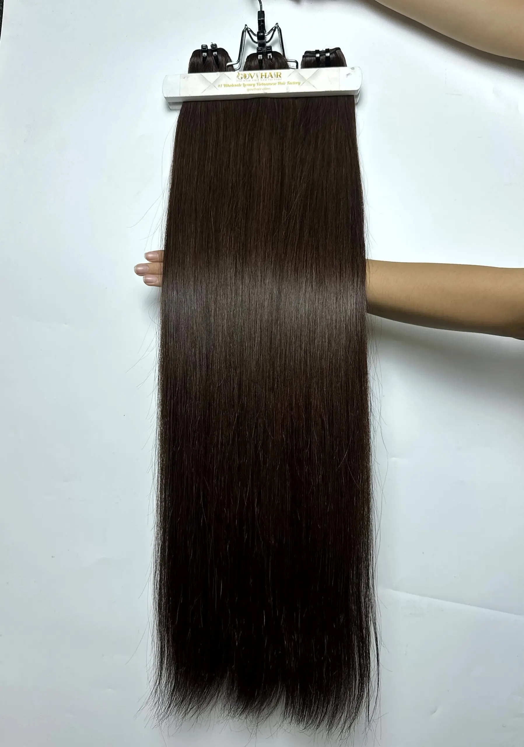 raw hair bundles in natural brown close up view 5