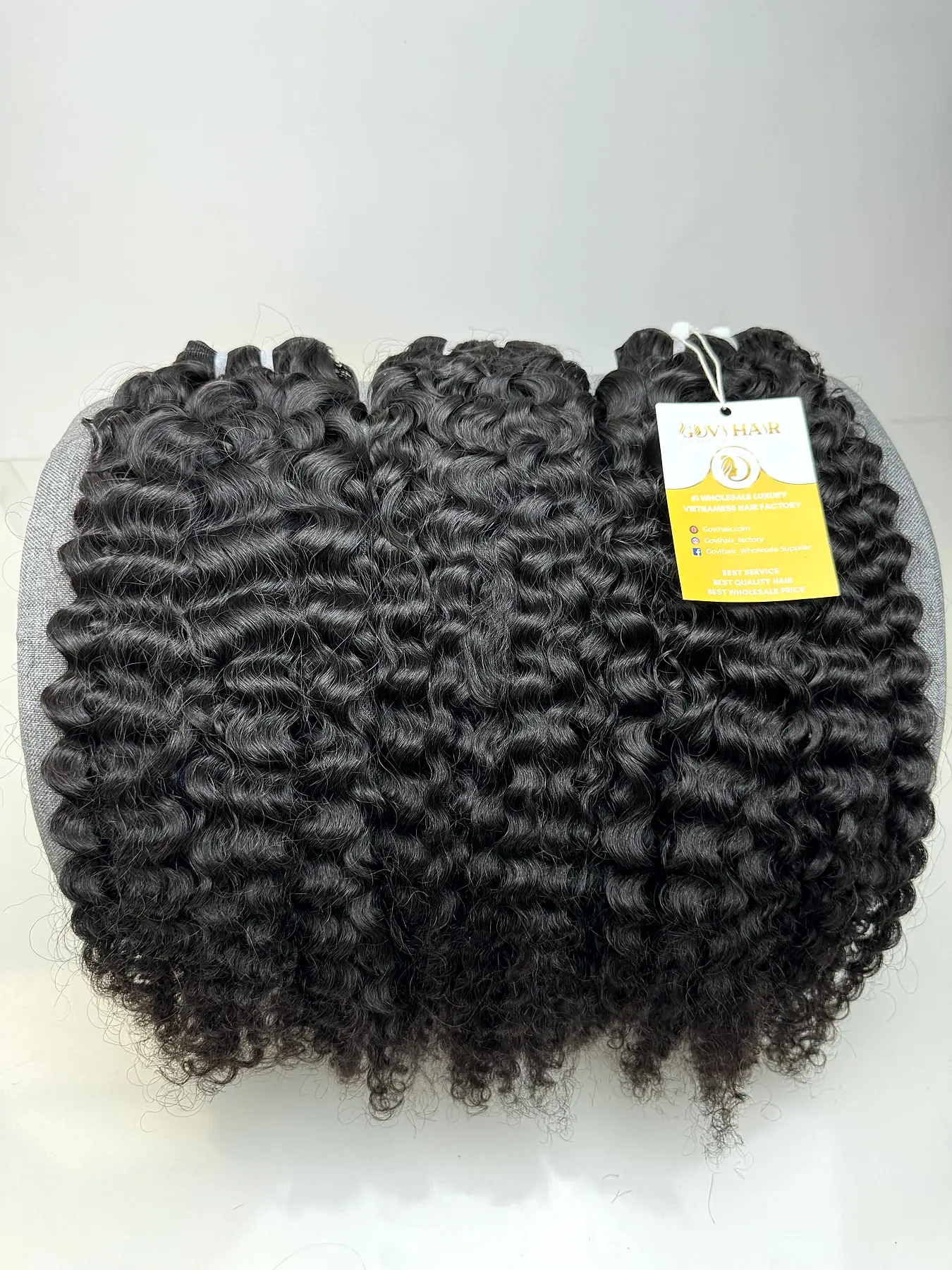 Raw Burmese curly hair bundles with label