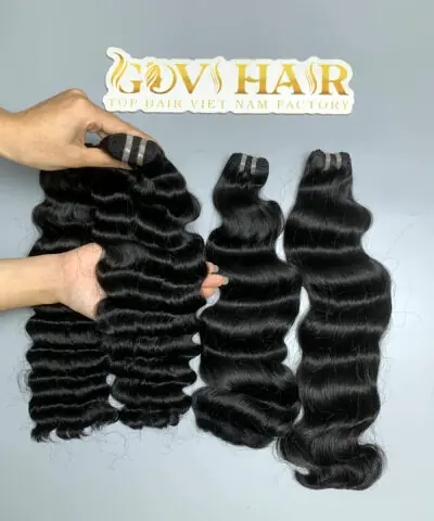 raw hair bundles with deep curly and natural wave held by hand showing shine