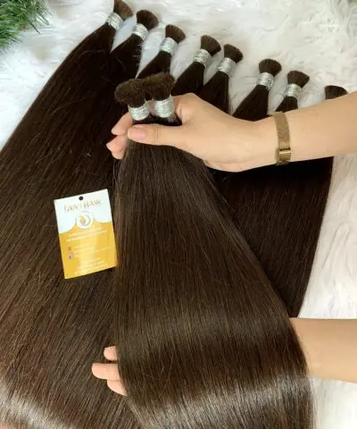 Human hair bulk 26 inch #2C held by hand