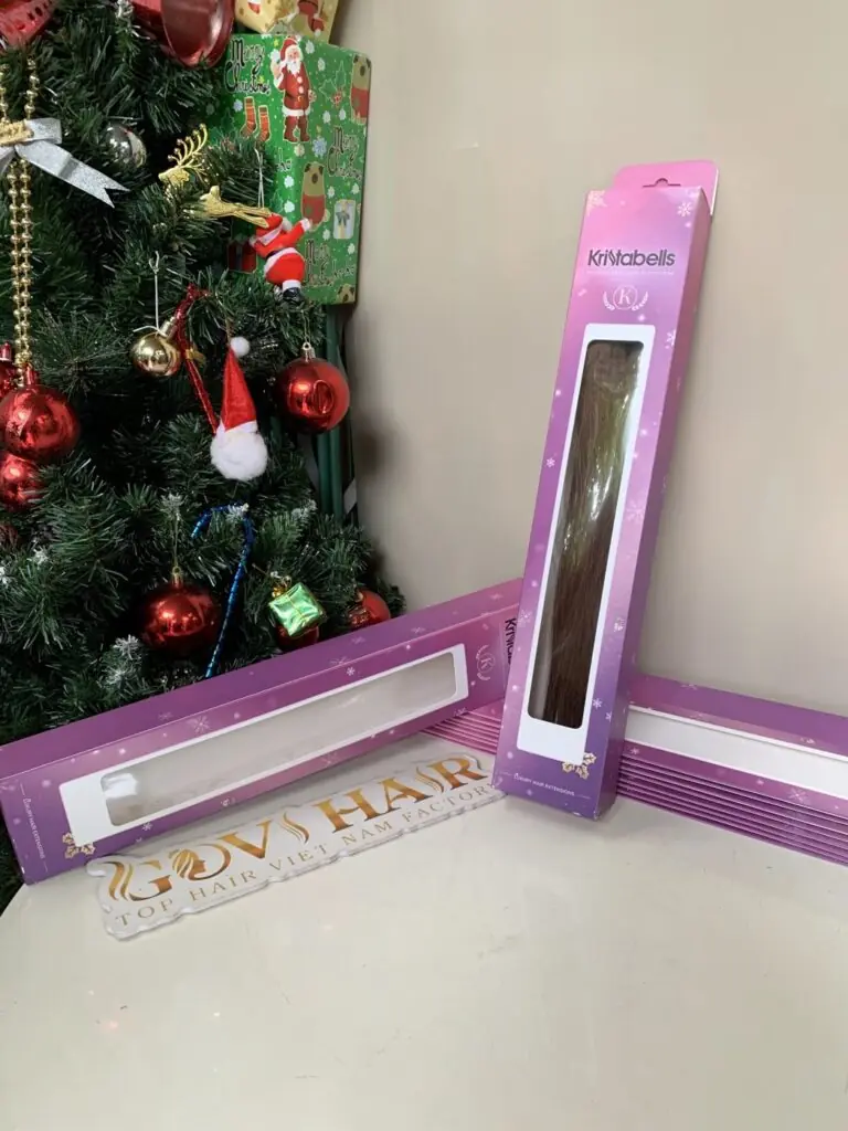 Home 162 Made-to-order premium hair packed in a client's pink window box at the Govihair factory